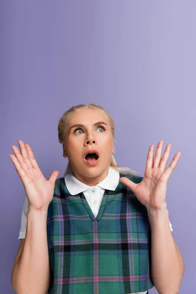 Scared Blonde Student Looking Away Isolated Purple —  Fotos de Stock