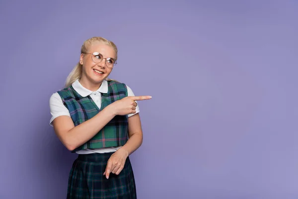 Smiling Student Uniform Eyeglasses Pointing Finger Isolated Purple — Φωτογραφία Αρχείου