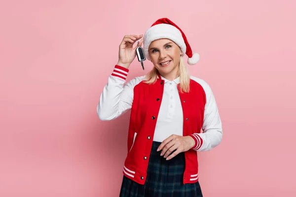Positive Woman Santa Hat Holding Car Key Isolated Pink — Stockfoto
