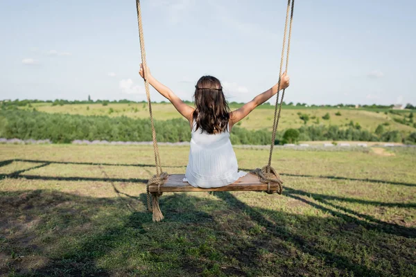 Back View Child Summer Dress Riding Swing Meadow — Stock Photo, Image