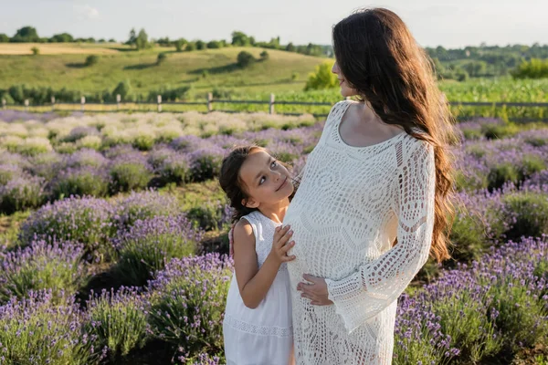 Cheerful Child Embracing Pregnant Mom Field Blossoming Lavender — Stock Photo, Image