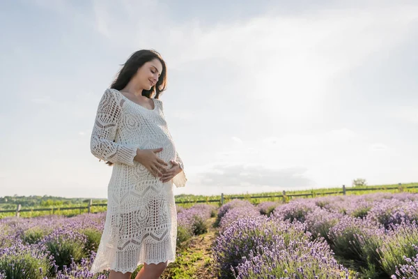 Happy Pregnant Woman Openwork Dress Hugging Belly Lavender Field — Foto de Stock