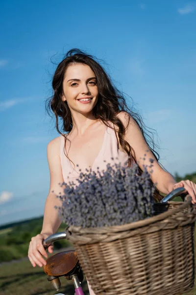 Cheerful Woman Long Hair Looking Camera Blurred Lavender — Foto de Stock