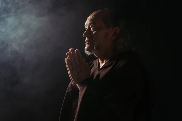 Mysterious Monk Black Cassock Praying Dark Background Smoke — Stock Photo, Image
