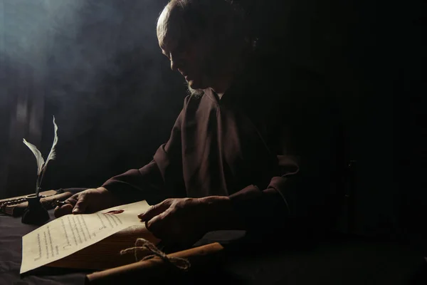 Medieval Monk Black Cassock Holding Ancient Manuscript Dark Background Smoke — Stock Photo, Image