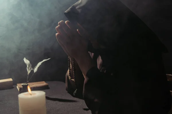 Medieval Monk Hooded Cassock Praying Rosary Beads Burning Candle Black — Stock Photo, Image