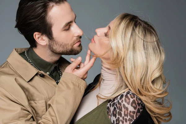 Stylish Bearded Man Touching Chin Blonde Woman While Flirting Isolated —  Fotos de Stock
