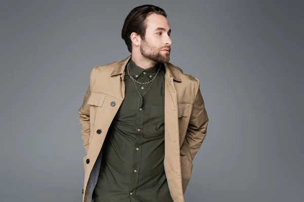 Bearded Man Beige Jacket Green Shirt Looking Camera Isolated Grey – stockfoto