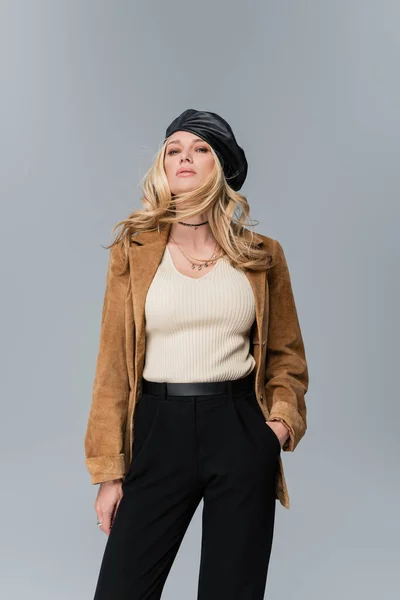 Blonde Woman Stylish Leather Beret Beige Blazer Standing Hand Pocket — Stok fotoğraf