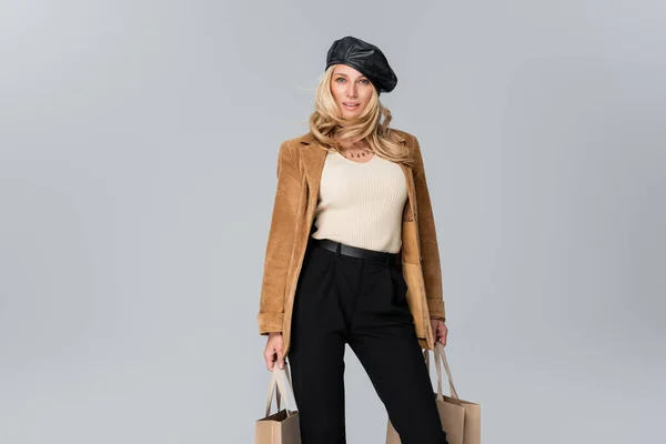 Smiling Woman Stylish Leather Beret Beige Blazer Holding Shopping Bags — 스톡 사진