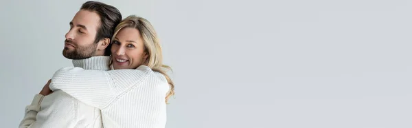 Cheerful Blonde Woman White Knitted Sweater Hugging Bearded Man Isolated — 图库照片