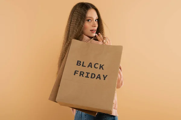 Smiling Teenage Girl Holding Paper Bags Black Friday Lettering Isolated — Fotografia de Stock