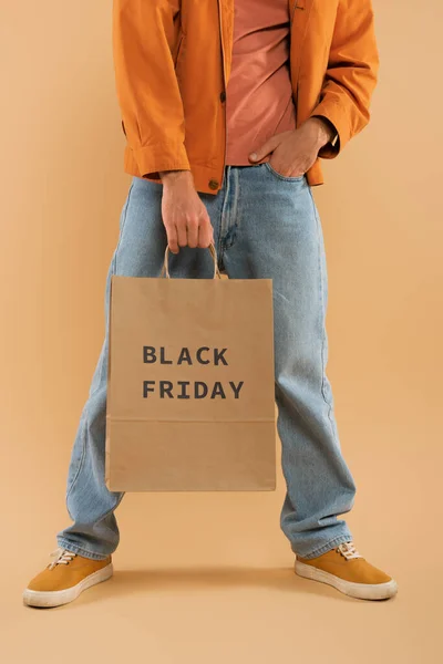 Cropped View Young Man Holding Shopping Bag Black Friday Lettering — 图库照片