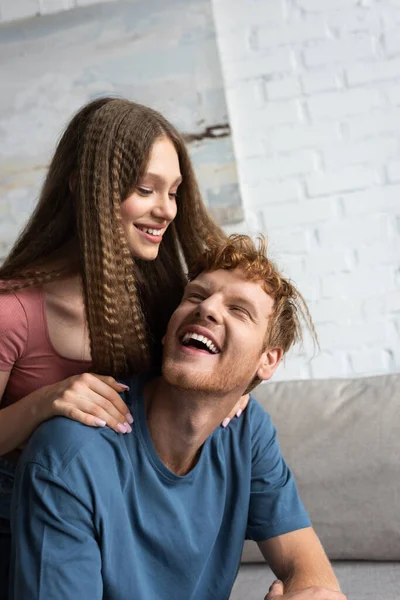 Cheerful Teen Girl Smiling Hugging Excited Boyfriend Living Room — Φωτογραφία Αρχείου