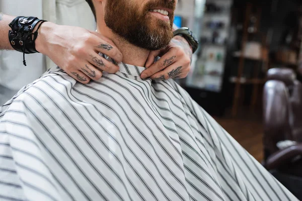Partial View Smiling Bearded Man Barber Putting Hairdressing Cape — Stock Photo, Image