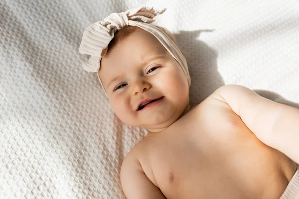 Top View Infant Girl Headband Lying Bed Looking Camera — Stock Photo, Image