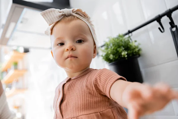 Portrait Infant Baby Girl Headband Bow Sitting Outstretched Hand Looking — Stock Photo, Image