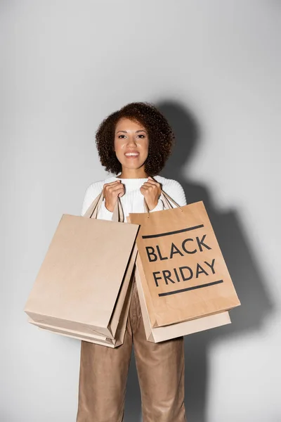 Positive Young African American Woman Holding Shopping Bags Black Friday — Stock Photo, Image