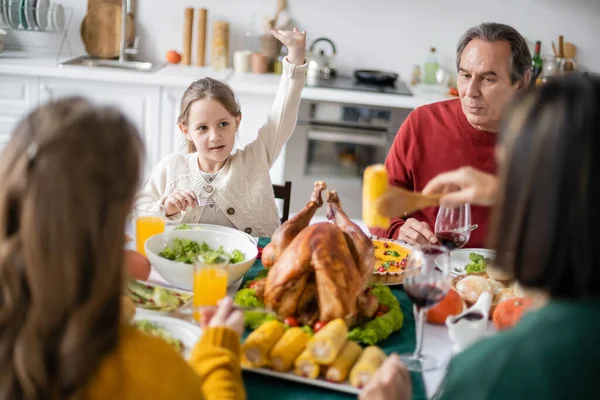 Girl Raising Hand Grandparents Sister Thanksgiving Dinner Home — Stock Photo, Image