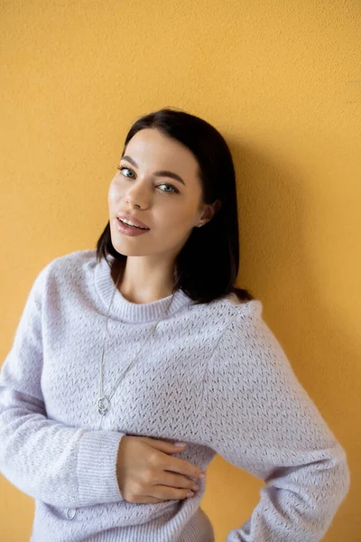 Pleased Brunette Woman Soft Knitted Sweater Smiling Camera Yellow Background — Stock Photo, Image