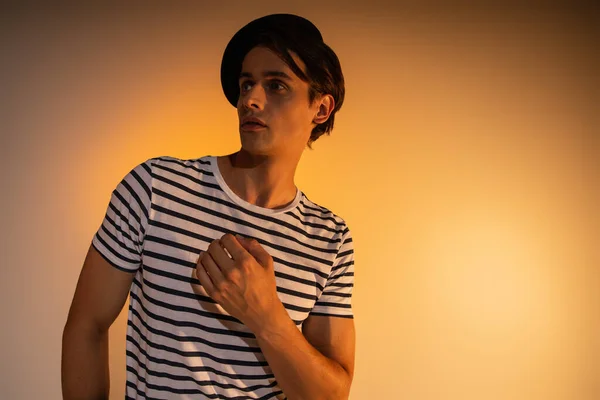 Stylish Man Beret Striped Shirt Looking Away While Posing Orange — Stock Photo, Image