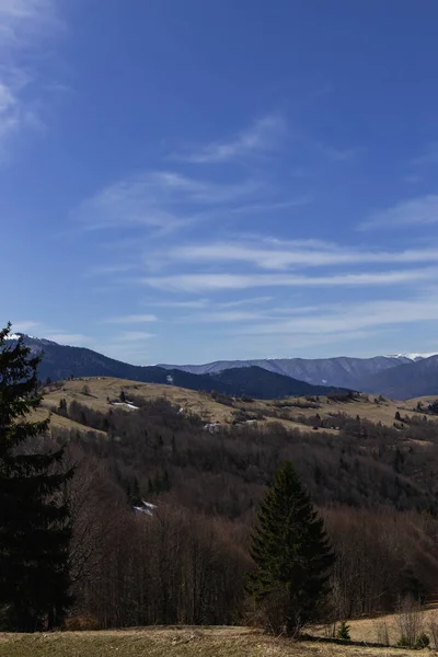 Blue sky with clouds above mountains at daytime — Stock Photo