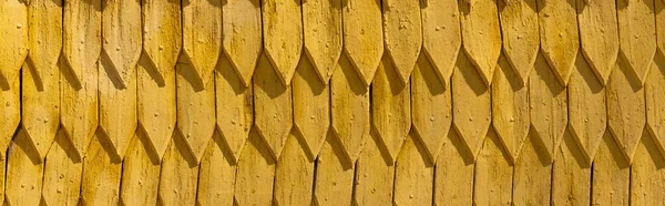 Yellow wooden roof at daytime outdoors, banner — Stock Photo