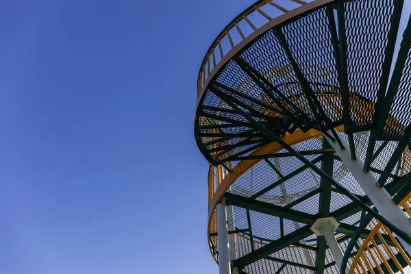 Low angle view of metal viewpoint with blue sky at background — стоковое фото