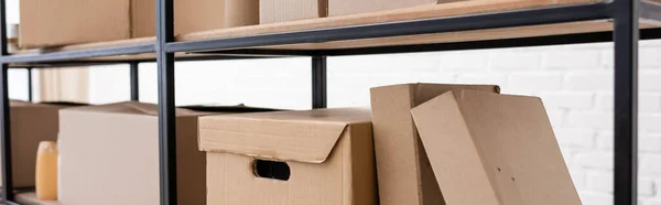 Various packages on rack in volunteer center, banner - foto de stock