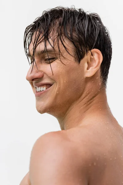 Happy man with wet hair and clean face smiling isolated on white - foto de stock