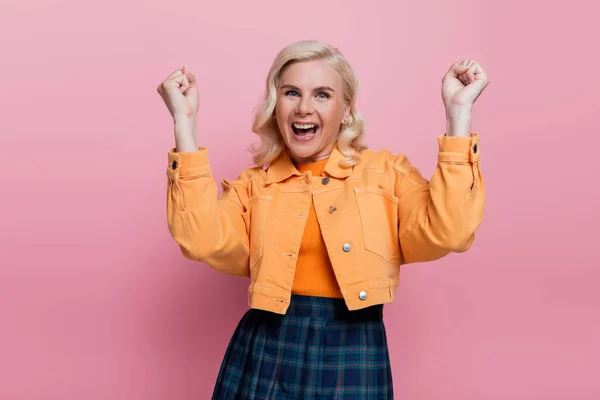 Pretty and excited woman showing yes gesture isolated on pink — Foto stock