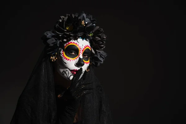 Woman in mexican day of dead costume and makeup showing hush sign isolated on black — Stock Photo