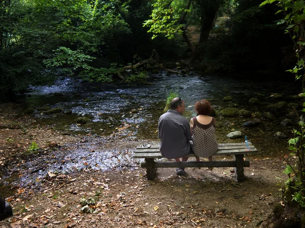 Couple next to a river