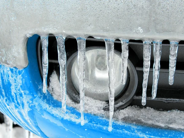 Icicles on the blue car bumper — Stock Photo, Image