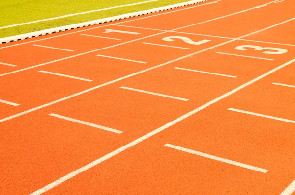 Finish line in tartan athletic track — Stock Photo, Image