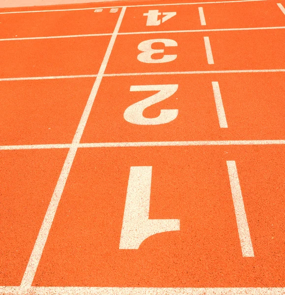 Finish line in tartan athletic track — Stock Photo, Image