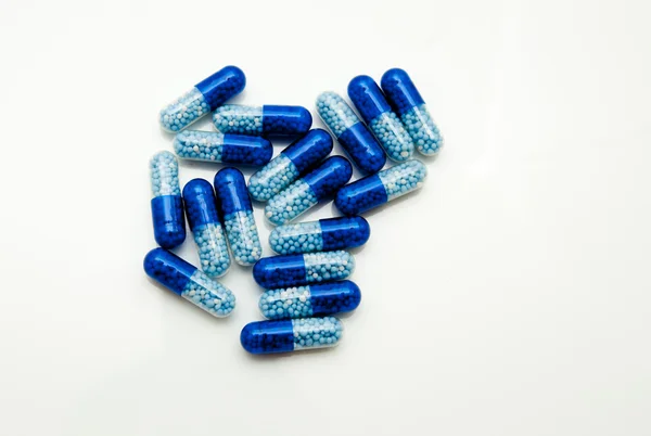 Una docena de pastillas azules — Foto de Stock