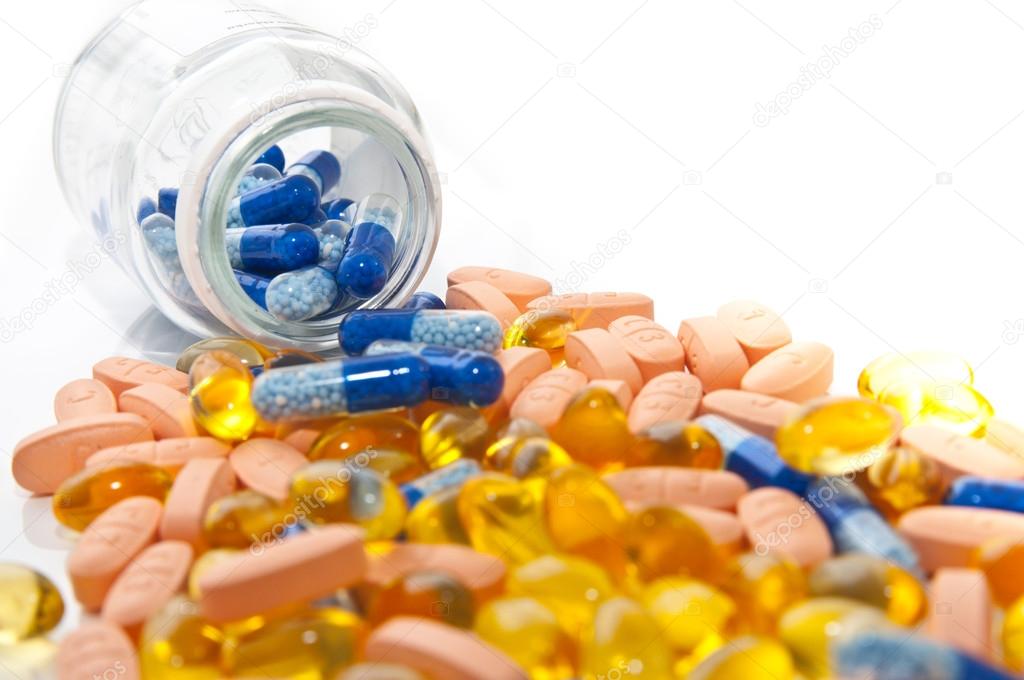 Multi-colored pills and a box