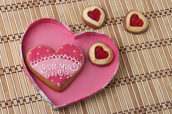 Heart-Shaped Cookies in a Pink Box on an wooden pad. — Stock Photo, Image