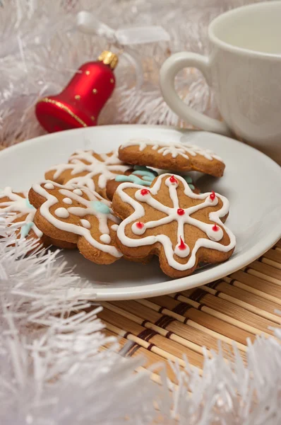 Decorated Sugar Cookies and Milk for Santa at Christmas Time on a table with decoration — Stock Photo, Image