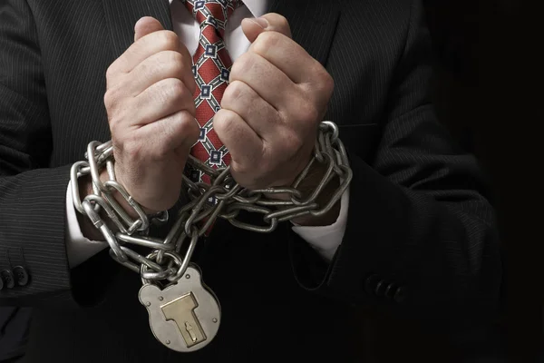 Businessman in chains — Stock Photo, Image