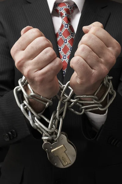 Businessman in chains — Stock Photo, Image