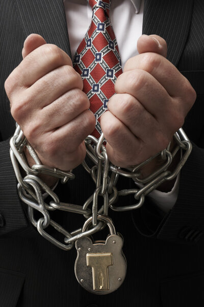 Businessman in chains