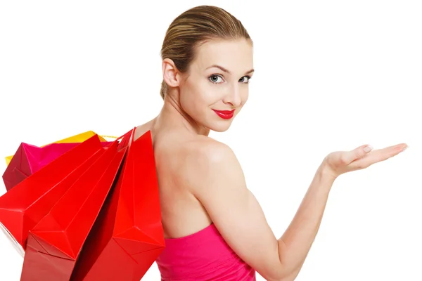 Mira lo que tengo... mujer sosteniendo bolsas de la compra — Foto de Stock