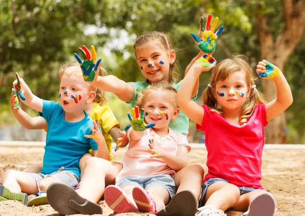 Happy kids with painted hands — Stock Photo, Image