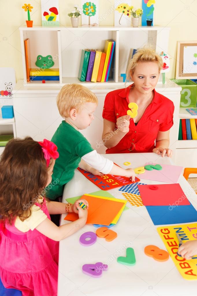 Preschoolers in the classroom with the teacher