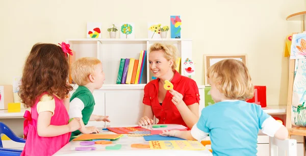Pre-school children in the classroom with the teacher — Stock Photo, Image