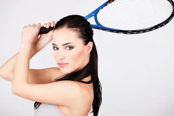 Pretty woman with tennis racket — Stock Photo, Image