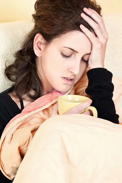 Woman holding her head in pain — Stock Photo, Image