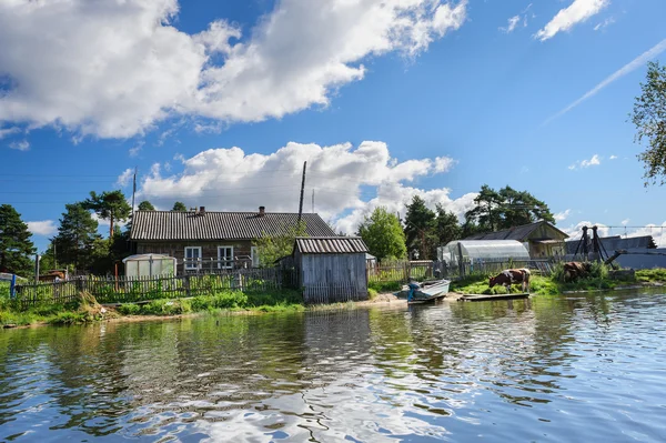 Russian wooden houses at river bank — Stock Image Russian wooden houses at river bank Stock Image
